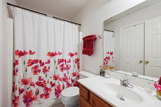 bathroom featuring vanity, curtained shower, and toilet