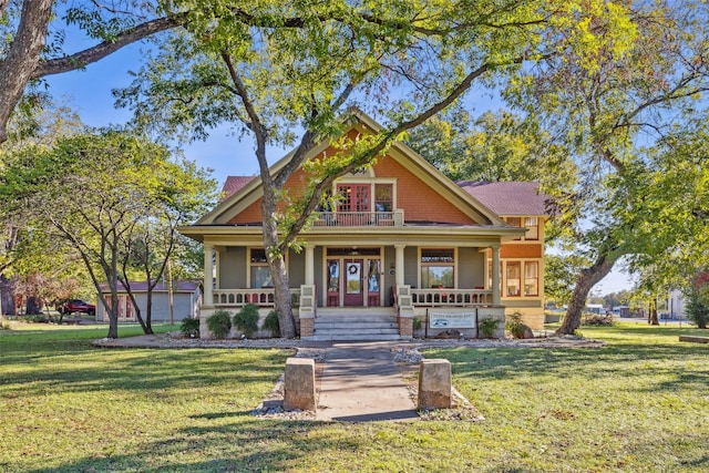 craftsman-style house featuring a porch and a front lawn