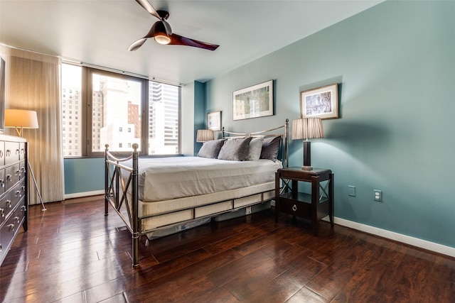 bedroom featuring dark wood-type flooring and ceiling fan