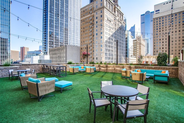 view of home's community with an outdoor hangout area and a yard