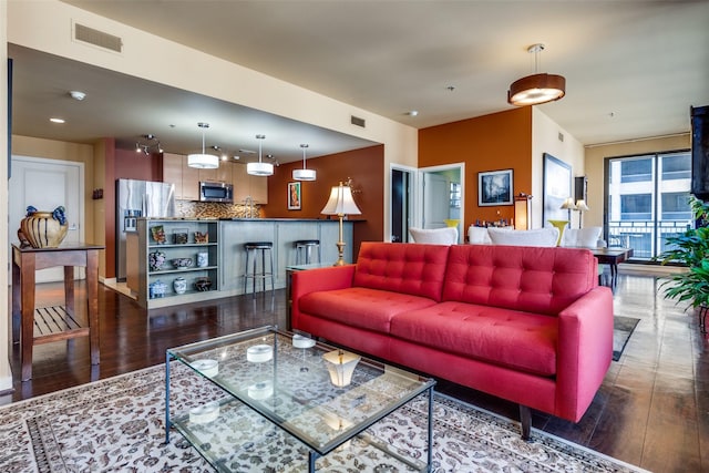 living room featuring dark hardwood / wood-style flooring