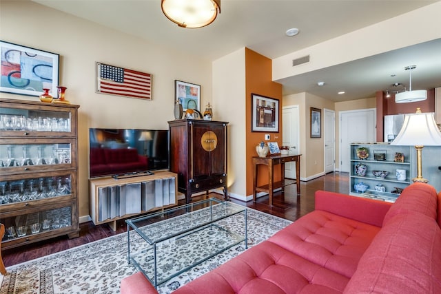 living room featuring dark hardwood / wood-style floors