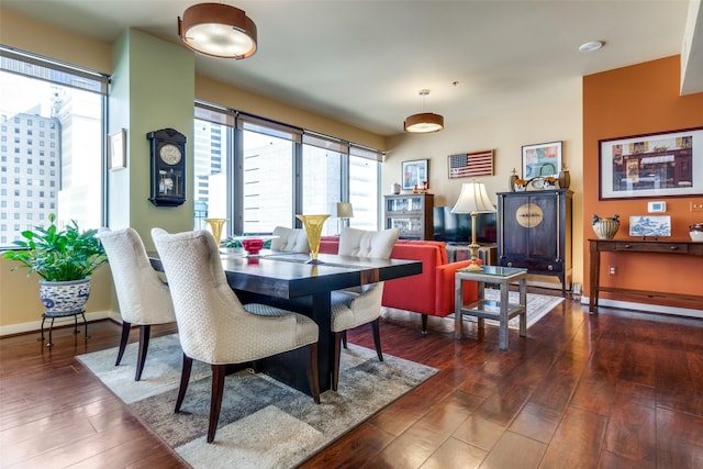 dining space featuring dark hardwood / wood-style flooring