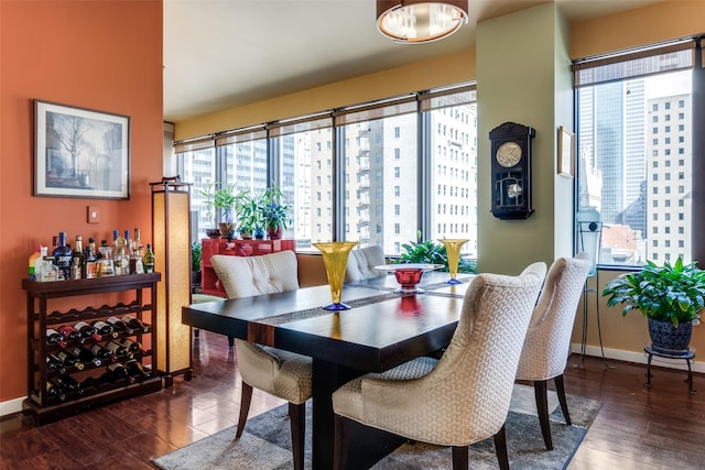 dining area featuring dark hardwood / wood-style floors