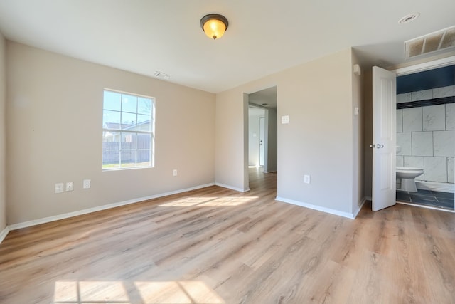 unfurnished bedroom featuring light wood-type flooring