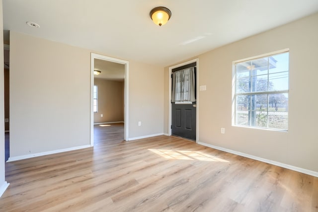 unfurnished room featuring light hardwood / wood-style floors