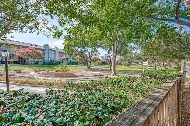 view of home's community featuring a yard