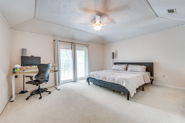 carpeted bedroom with vaulted ceiling, ceiling fan, access to exterior, and a textured ceiling