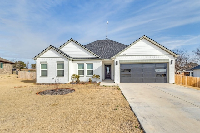 ranch-style house with a garage and a front lawn