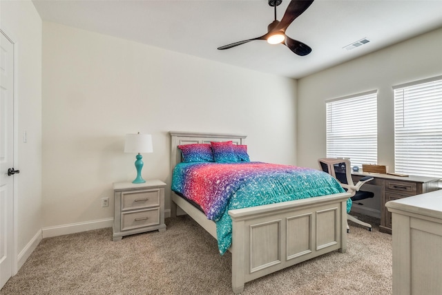 bedroom featuring light carpet and ceiling fan