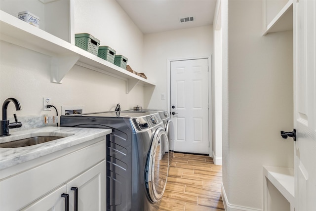 laundry room with sink and washing machine and dryer