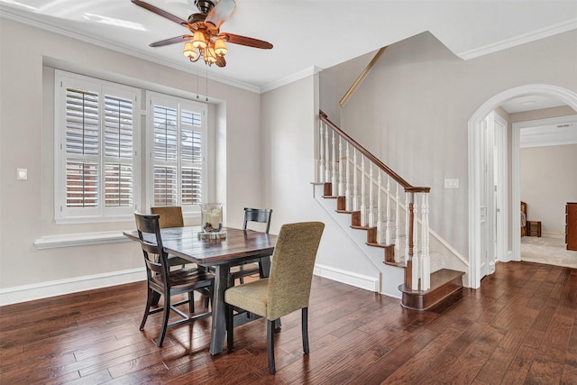 dining area with crown molding and dark hardwood / wood-style flooring