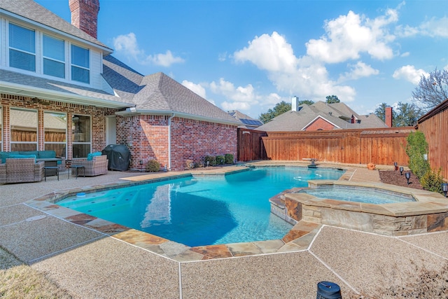 view of swimming pool with a patio area, grilling area, outdoor lounge area, and an in ground hot tub