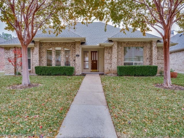 ranch-style home with a front yard