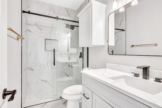 bathroom with an enclosed shower, vanity, and toilet