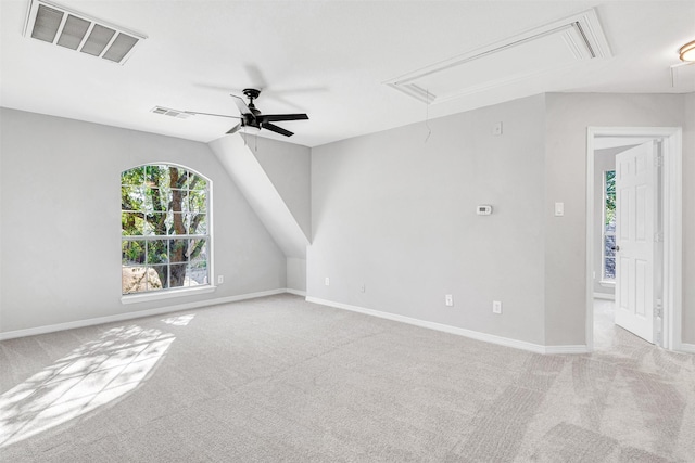 interior space featuring ceiling fan and vaulted ceiling