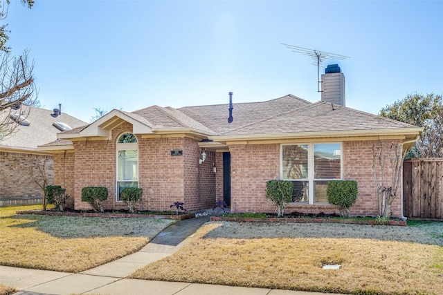 ranch-style home with a front lawn