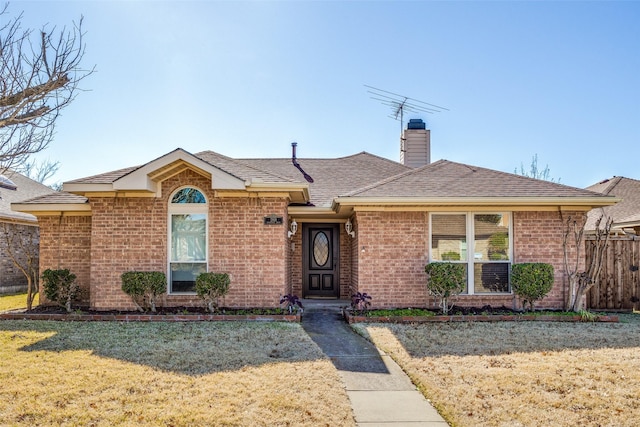 ranch-style home featuring a front yard