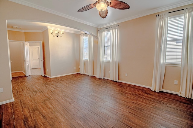 spare room with crown molding, ceiling fan with notable chandelier, and light hardwood / wood-style floors