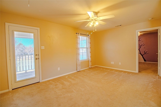 carpeted empty room with ceiling fan