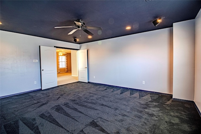 unfurnished room featuring carpet flooring and ceiling fan