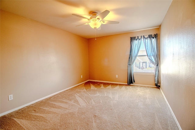 empty room with light carpet and ceiling fan