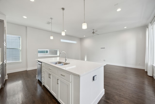 kitchen with sink, white cabinetry, decorative light fixtures, a center island with sink, and stainless steel dishwasher