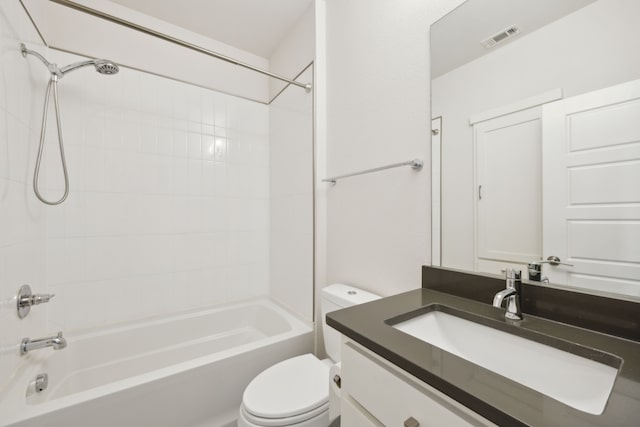 full bathroom featuring vanity, toilet, and tiled shower / bath