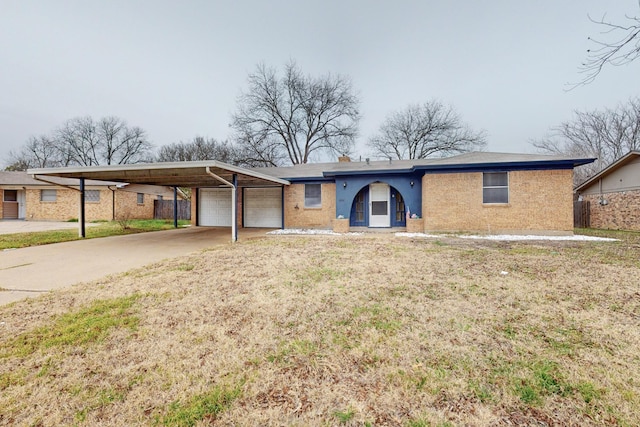 ranch-style home featuring a garage and a front yard