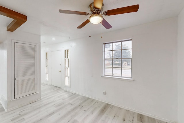 spare room with ceiling fan and light hardwood / wood-style flooring