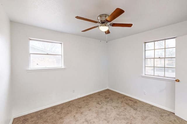 carpeted empty room with ceiling fan