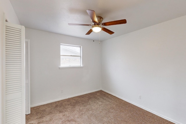 unfurnished bedroom with light carpet, ceiling fan, and a closet