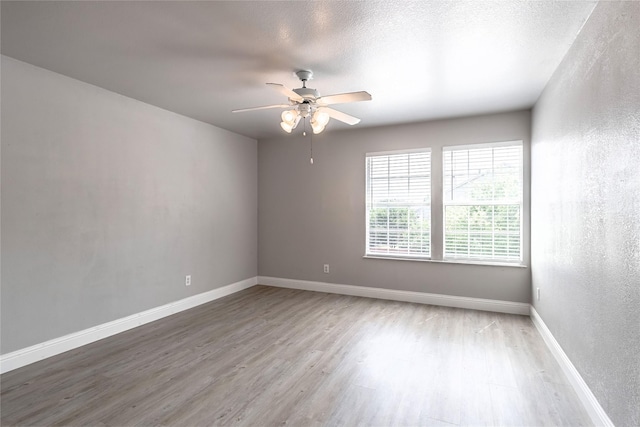 4201 Broken Bend Blvd, Fort Worth, TX 76244 - empty room featuring a ceiling fan, wood finished floors, and a textured wall