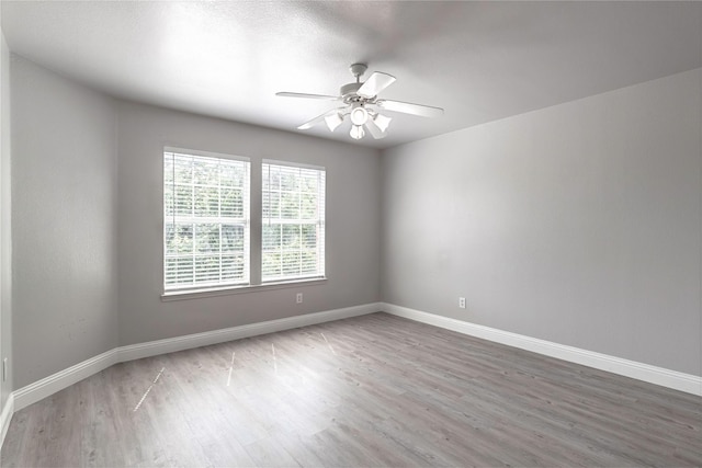4201 Broken Bend Blvd, Fort Worth, TX 76244 - empty room with wood finished floors and a ceiling fan
