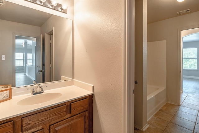 4201 Broken Bend Blvd, Fort Worth, TX 76244 - full bathroom featuring vanity, tile patterned flooring, and  shower combination
