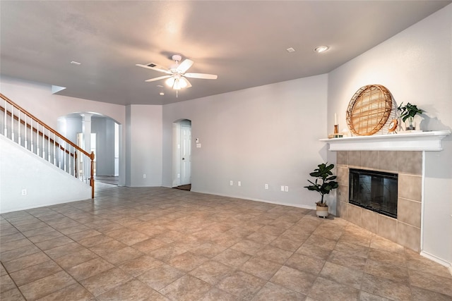 4201 Broken Bend Blvd, Fort Worth, TX 76244 - unfurnished living room with arched walkways, a ceiling fan, decorative columns, a fireplace, and stairs