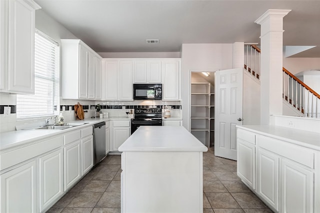 4201 Broken Bend Blvd, Fort Worth, TX 76244 - kitchen featuring black appliances, a kitchen island, healthy amount of natural light, and decorative backsplash