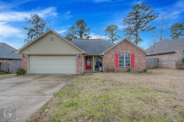 ranch-style home featuring a garage and a front lawn