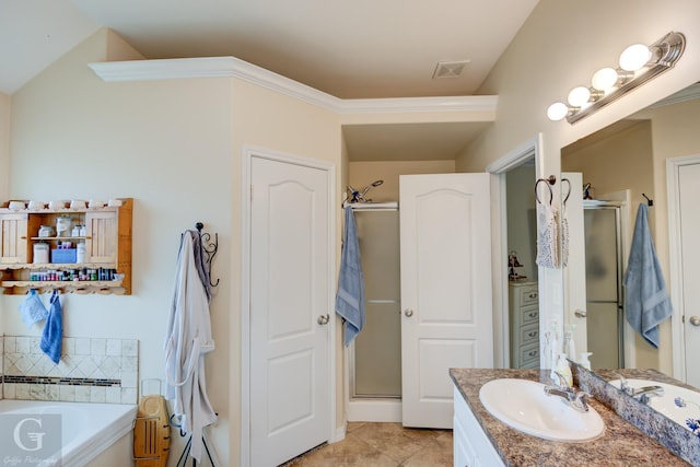 bathroom with vanity, independent shower and bath, and tile patterned flooring