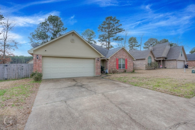 ranch-style house featuring a garage and a front yard