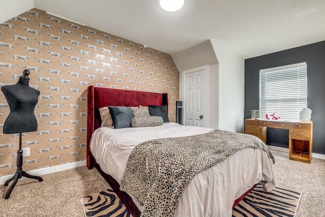 bedroom with lofted ceiling and carpet floors