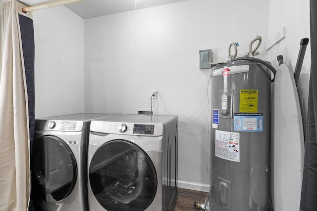 laundry room featuring wood-type flooring, separate washer and dryer, and electric water heater