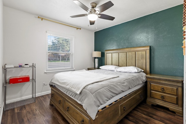 bedroom with ceiling fan and dark hardwood / wood-style floors