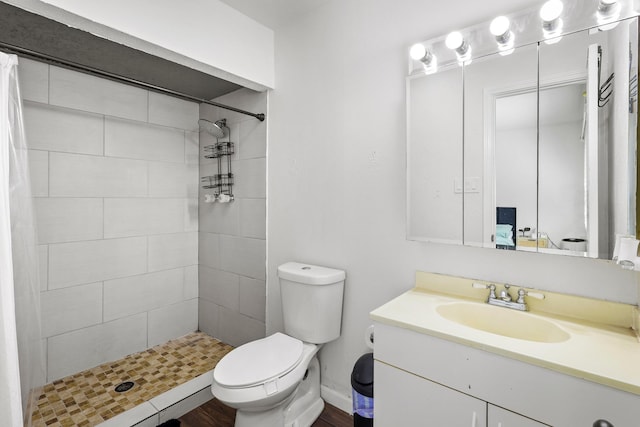 bathroom with vanity, curtained shower, and toilet