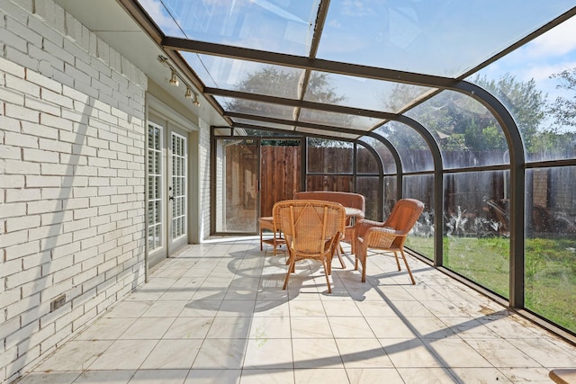 sunroom with track lighting