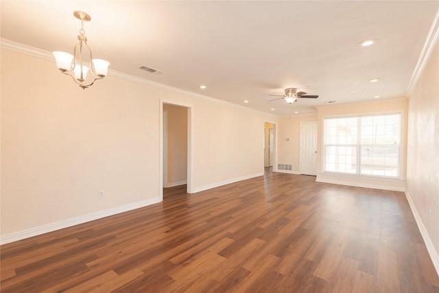 empty room featuring crown molding, ceiling fan with notable chandelier, and dark hardwood / wood-style flooring