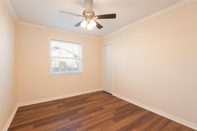 spare room with crown molding, ceiling fan, and dark hardwood / wood-style floors