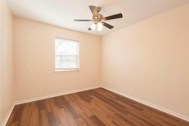 spare room with hardwood / wood-style flooring and ceiling fan