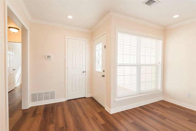 entryway with crown molding and dark hardwood / wood-style floors