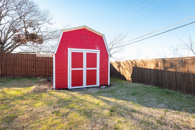 view of outbuilding featuring a lawn